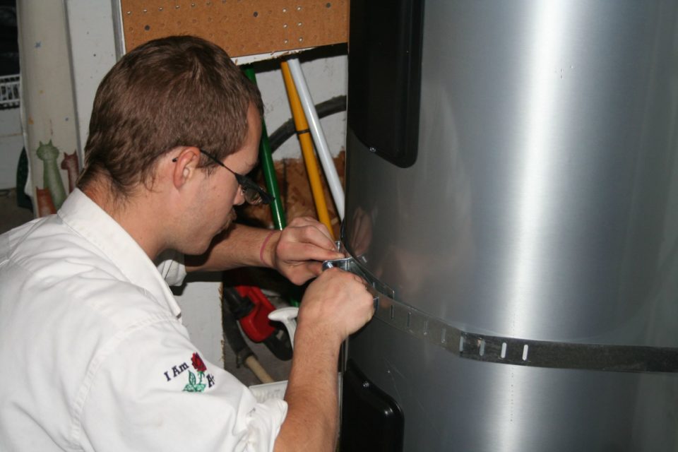 A Plus Plumbing Installing Water Heater